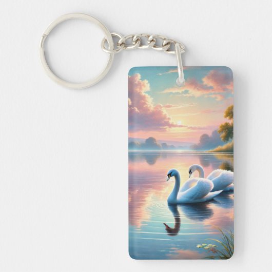 2羽の白鳥が穏やかな湖をすべっていた キーホルダー (正面)