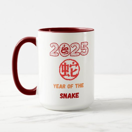 2025年のヘビ マグカップ (左)
