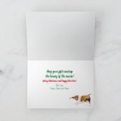 3シェットランド・ シープドッグが贈り物の包みを解き、折り畳まれたクリスマス シーズンカード (内部)