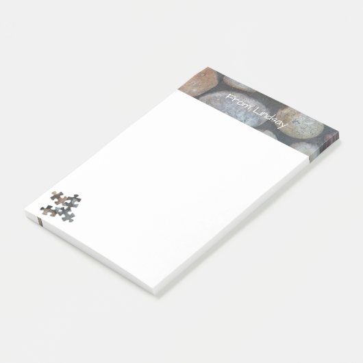 4つの地球の調子のパズルの部分の川の石の上のボーダー ポストイット (アングル)