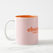 40歳の誕生日「応援40年」ピンク色のオレンジ ツートーンマグカップ (左)