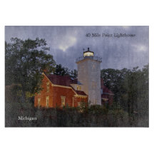 40 Mile Point Light house at dusk cutting board