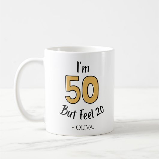 50おもしろい誕生日- 「50だけど20感じだ」 コーヒーマグカップ (左)