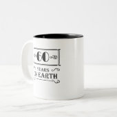 60 years on earth ツートーンマグカップ (正面左)