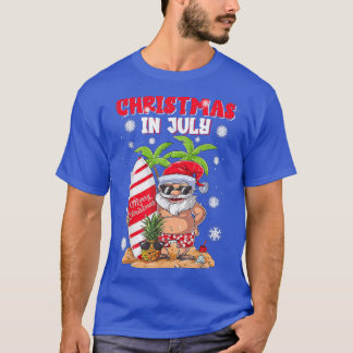 7月のクリスマスおもしろいサンタ夏おもしろいビーチ Tシャツ