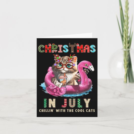 7月のクリスマスにくつろぐ猫 フラミンゴフロートニャー カード (正面)