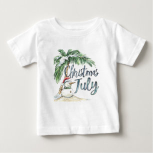 7月のクリスマス ビーチの雪だるまとヤシの木 ベビーTシャツ
