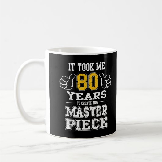 80誕生日このMを作るのに80年かかった コーヒーマグカップ (左)