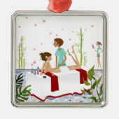 aにあっている女性をマッサージしているマッサージセラピスト メタルオーナメント (正面)