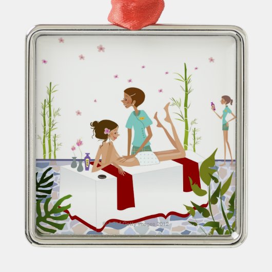 aにあっている女性をマッサージしているマッサージセラピスト メタルオーナメント (正面)