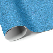 A blue sheet of textured material rolled up at one ラッピングペーパー (ロールコーナー)