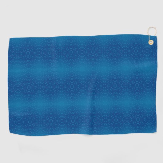 A blue towel with a subtle dotted pattern hangs  ゴルフタオル (横)