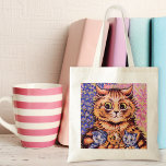 A Cat with her Kittens Louis Wain トートバッグ<br><div class="desc">A tote bag with a fine art illustration by the English artist Louis Wain,  a Cat with her Kittens. He was best known for his drawings of animals and country scenes,  especially large-eyed cats. This illustration is of a surprised mother cat holding three kittens,  two of which are blue.</div>