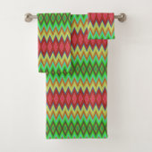 A colorful, geometric-patterned towel set hangs バスタオルセット (インサイチュ)