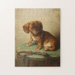 A Dachshund Puppy | Carl Reichert ジグソーパズル<br><div class="desc">A Dachshund Puppy (1888) | Carl Reichert’s A Dachshund Puppy is a delightful portrait featuring a small brown dachshund puppy perched on a wooden stool. The artwork captures the puppy’s curious and innocent expression with exquisite detail, from the soft texture of its fur to the subtle shading of its surroundings....</div>