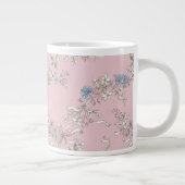 a delicate bouquet of wildflowers on a pink backgr ジャンボコーヒーマグカップ (右)