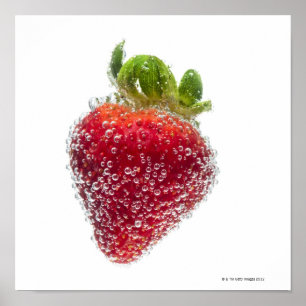 A juicy ripe organic Strawberry fruit submerged ポスター