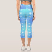 A person wearing vibrant blue leggings adorned  カプリレギンス (裏面)