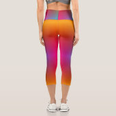A person wearing vibrant, rainbow-gradient legging カプリレギンス (裏面)