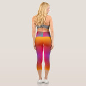 A person wearing vibrant, rainbow-gradient legging カプリレギンス (裏面)