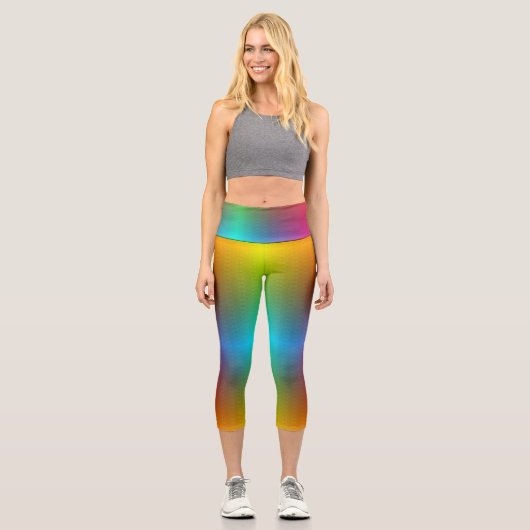 A person wearing vibrant, rainbow-gradient legging カプリレギンス (正面)