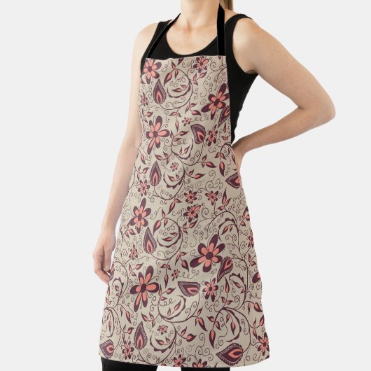 A person wears a floral-patterned apron  エプロン (インサイチュ)