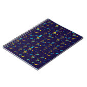 A spiral notebook with a dark blue cover  ノートブック (左側)