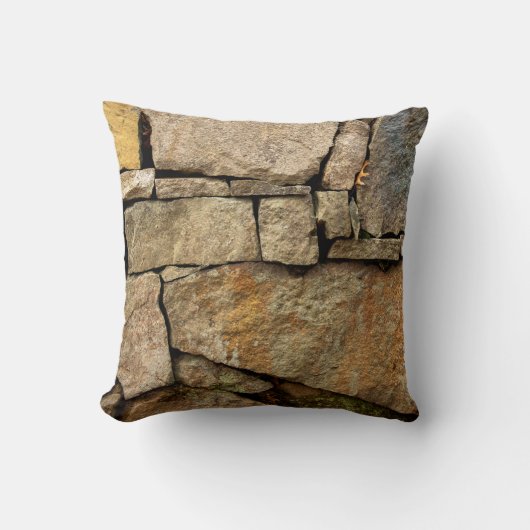 A stone wall made of cobblestones background textu クッション (正面)