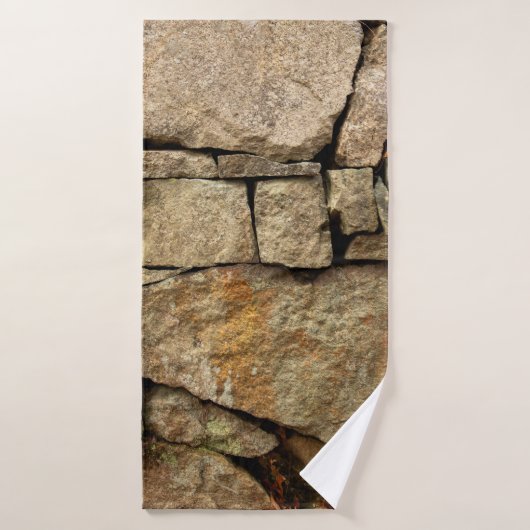 A stone wall made of cobblestones background textu バスタオル (バスタオル)