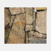 A stone wall made of cobblestones background textu フリースブランケット (正面(横))