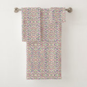A vibrant, colorful towel hangs on a rod バスタオルセット (インサイチュ)
