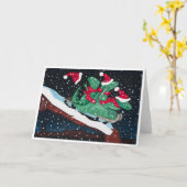 A whimsical holiday card with sledding dinosaurs カード (黄色い花)