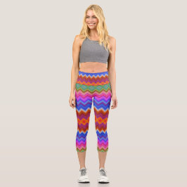 A woman wears vibrant, zigzag-patterned leggings  カプリレギンス