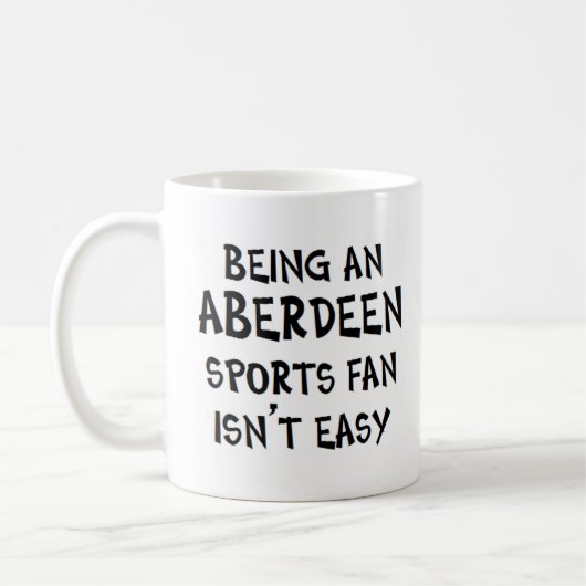 aberdeen sports fan, being コーヒーマグカップ (左)