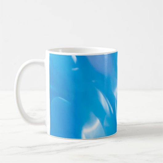 Abstract glitter lights on blue background. Round コーヒーマグカップ (左)