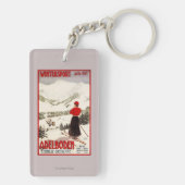 Adelbodenポスターを見落としている女性のスキーヤー キーホルダー (裏面)