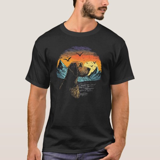 Airedale Terrier Dog and Sun Rising Over Mountains Tシャツ (正面)
