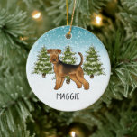 Airedale Terrier Dog Snowy Winter Forestと名前 セラミックオーナメント<br><div class="desc">可愛いAiredale Terrierのオリジナル漫画イラストレーション。3本の緑のモミの木と降り積もる雪が積もった冬のシーンに犬を置く。背景は青から白のグラデーション与えのデザインは、寒い冬の日に見える。名前またはその他の文字文字には、パーソナル化可能なカスタム領域もある。</div>