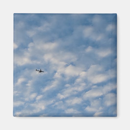 Airplane Crossing a Cloud-Filled Blue Sky マグネット (正面)
