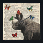 Altered Art Rhinoceros  Butterflies Wall Clock スクエア壁時計<br><div class="desc">Altered art vintage dictionary book page featuring a vintage rhinoceros illustration. The antique rhinoceros picture is surrounded by colorful butterflies that are also done in a vintage style. This vintage print is perfect for framing and is available on a variety of products.</div>
