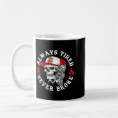 Always Tired Never Broke Funny Skull (on Back)  コーヒーマグカップ (左)