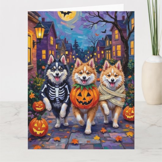 American Eskimo Dogs Trick-or-Treating Halloween カード (正面)