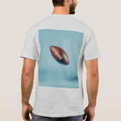 American football ball in the air with bright ligh tシャツ (裏面)