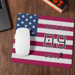 American Soccer Athlete Personalized Stars Stripes マウスパッド<br><div class="desc">Enhance your workspace with this high-quality mousepad featuring a bold "Team USA" soccer theme. This durable desk accessory provides a smooth surface for precise tracking while showcasing your national pride with a vibrant stars and stripes background. The design is fully personalizable with a custom name and jersey number, both featuring...</div>