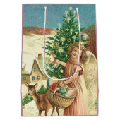 Angel bringing Christmas gifts and presents ミディアムペーパーバッグ (裏面)