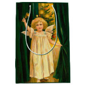 Angel ringing the bell for Christmas time ミディアムペーパーバッグ (正面)