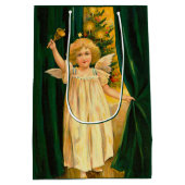 Angel ringing the bell for Christmas time ミディアムペーパーバッグ (裏面)