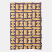 Array of various pasta shapes on a purple キッチンタオル (縦)
