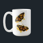 Artistic Watercolor Monarch Butterfly Nature Art コーヒーマグカップ<br><div class="desc">The design features two vibrant monarch butterflies in mid-flight, rendered with artistic paint splatters in warm shades of orange and yellow. This nature-inspired graphic captures the delicate elegance of spring wildlife. It makes a wonderful gift for gardeners, entomology enthusiasts, nature lovers, or anyone who appreciates the symbolism of freedom and...</div>