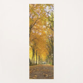 Autumn path with yellow trees and fallen leaves ヨガマット (正面)